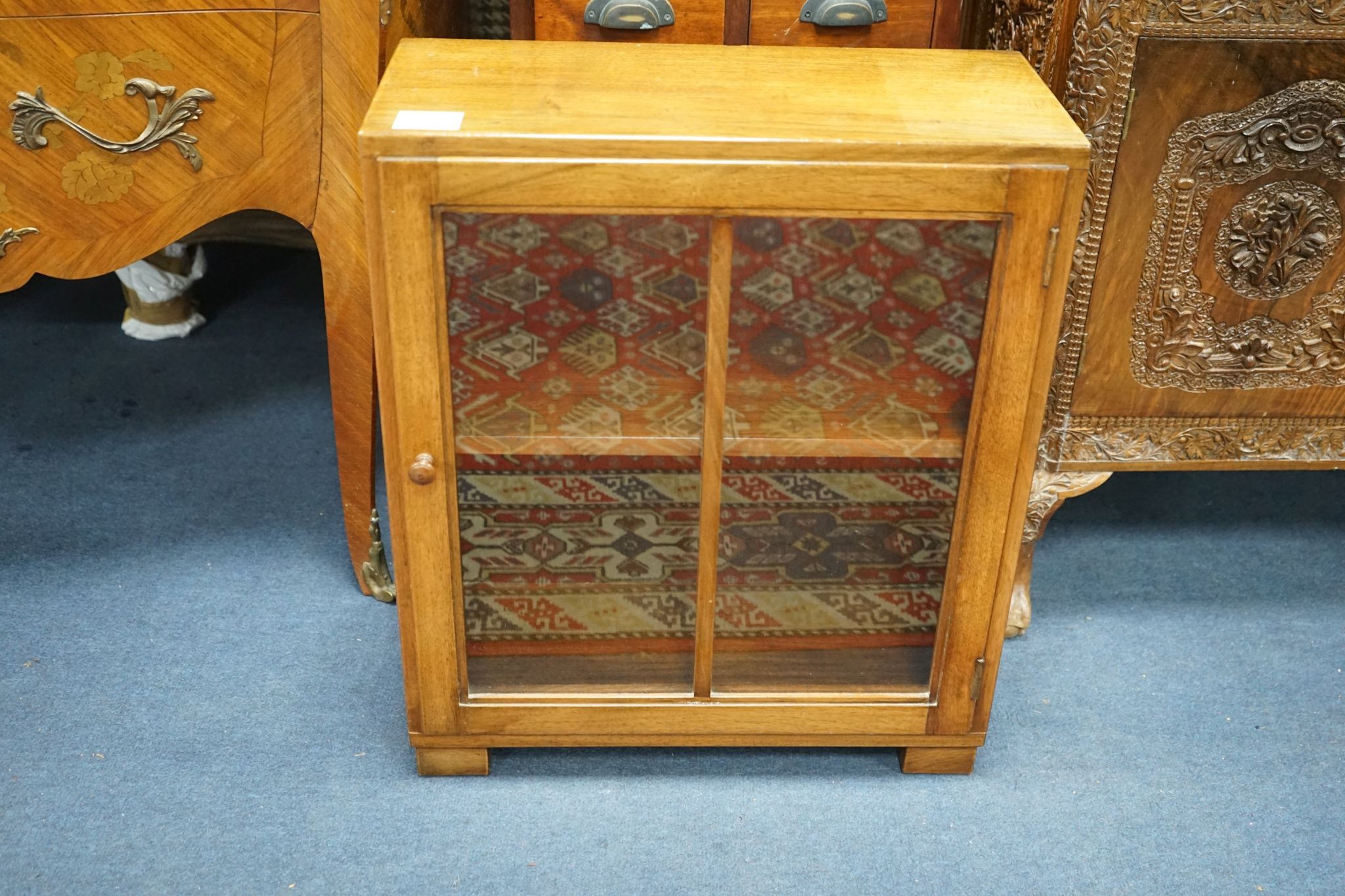 A reproduction hardwood ten drawer narrow chest, width 40cm, depth 26cm, height 102cm together with a glazed hardwood wall cabinet